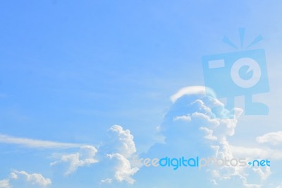 Blue Sky Background With White Clouds Stock Photo