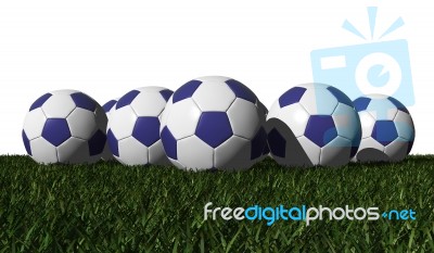 Blue Soccer Balls On A Green Grass Stock Image