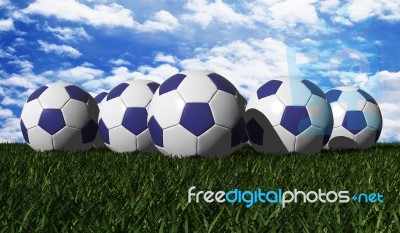 Blue Soccer Balls On Grass Stock Image