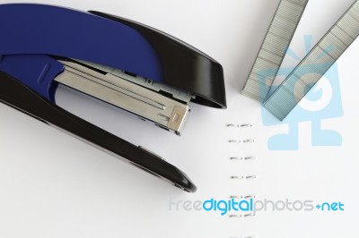 Blue Stapler With Staples And Paper On The Table, Selective Focu… Stock Photo