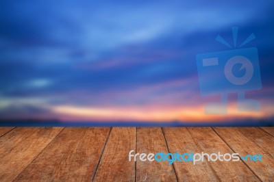 Blue Sunset Sky And Wood Floor Background Stock Photo