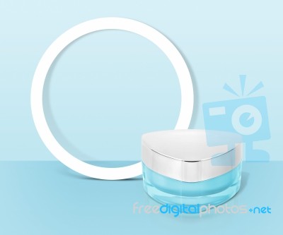 Blue Triangle Cosmetic Jar On Paper Frame Background Stock Photo