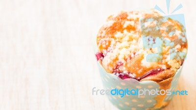 Blueberry Muffins In Paper Cupcake On Wooden Background Stock Photo