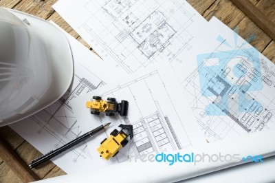 Blueprints, Hardhat Or Safty Helmet, Pen In Architecture Office Stock Photo