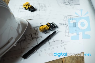 Blueprints, Hardhat Or Safty Helmet, Pen In Architecture Office Stock Photo