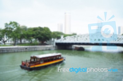 Blurred Abstract Background Of Boats Are Sailing On The River Underneath The Bridge Stock Photo