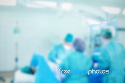 Blurred Background With Team Surgeon At Work In Operating Room Stock Photo