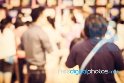 Blurred Crowd Of People Watching Art Exhibition In The Hall Stock Photo