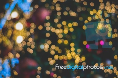 Blurred Glitter Ball Celebrate Christmas Tree With Illumination Bulb Light Background, Soft Color Cinematic Vignette Tone Stock Photo