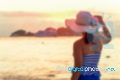 Blurred Image Tourist Woman On The Beach Stock Photo