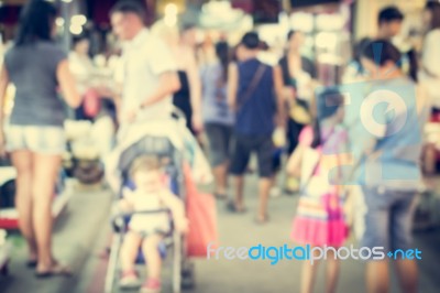 Blurred People Are In The Market Stock Photo