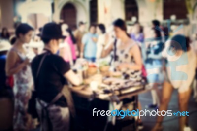 Blurred People Buying Food On The Street Stock Photo