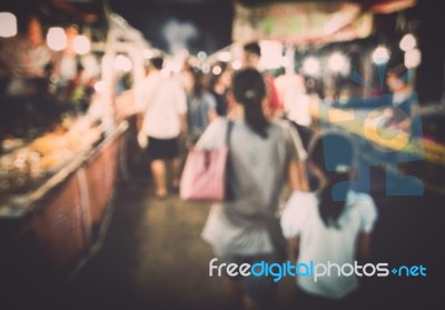 Blurred People In Local Night Market Stock Photo