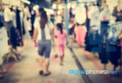 Blurred People Walking In The Market Stock Photo