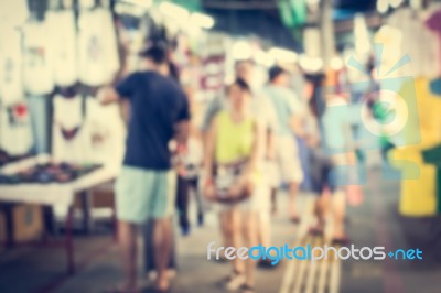 Blurred People Walking In The Market Stock Photo