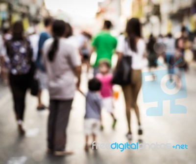 Blurred People Walking On The Street Stock Photo