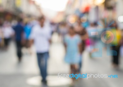 Blurred People Walking On The Street Of Old Town Stock Photo