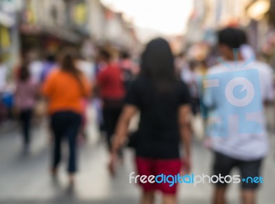 Blurred People Walking On The Street Of Old Town Stock Photo