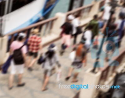 Blurred Tourist Walking On The Jetty Stock Photo