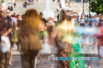 Blurry People Walking In The Street Stock Photo