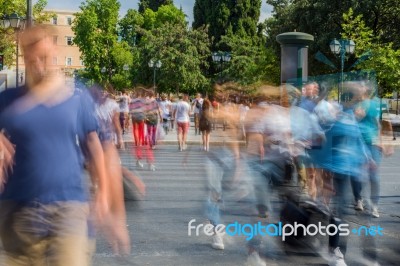 Blurry People Walking In The Street Stock Photo