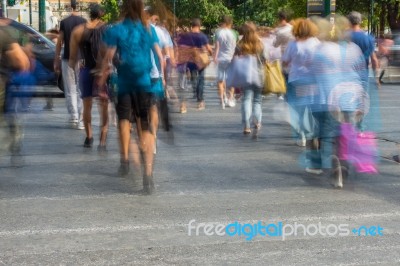 Blurry People Walking In The Street Stock Photo