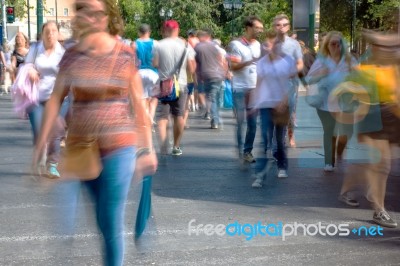 Blurry People Walking In The Street Stock Photo