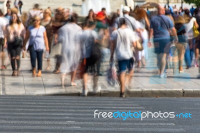 Blurry People Walking In The Street Stock Photo