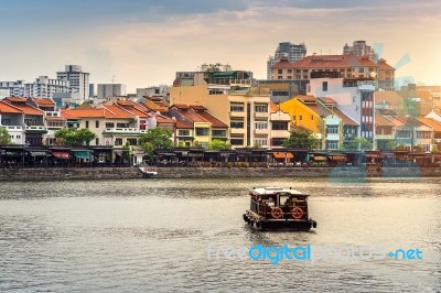 Boat And Cityscape In Singapore Stock Photo