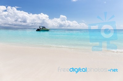 Boat On Clear Sea And Sand With Blue Sky Background In Phuket, Thailand Stock Photo