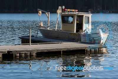 Boat On Placid Lake Stock Photo