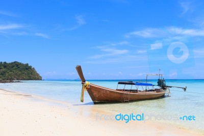 Boat On The Beach With Blue Sky Stock Photo