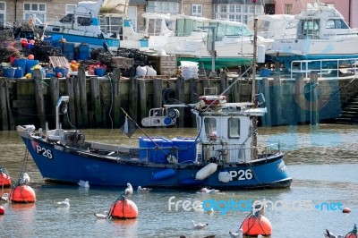 Boats In The Harbour At Lyme Regis Stock Photo