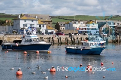 Boats In The Harbour At Lyme Regis Stock Photo