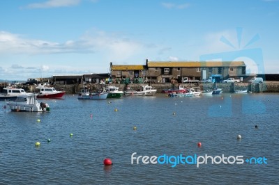 Boats In The Harbour At Lyme Regis Stock Photo