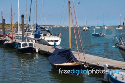 Boats Moored At A Jetty In Wells Stock Photo