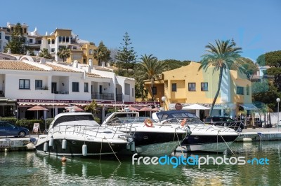 Boats Moored In Cabo Pino Harbour Stock Photo