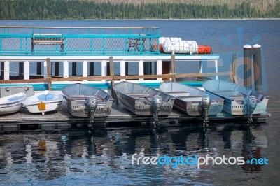 Boats On A Jetty In Lake Mcdonald Near Apgar Stock Photo