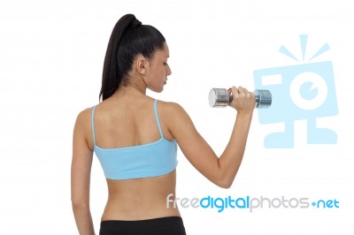 Body Of Slim Female In Activewear Doing Exercise With Dumbbells Stock Photo