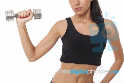 Body Of Slim Female In Activewear Doing Exercise With Dumbbells Stock Photo