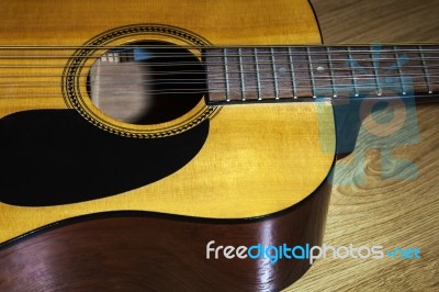 Body Part Of Yellow 12 String Guitar Stock Photo