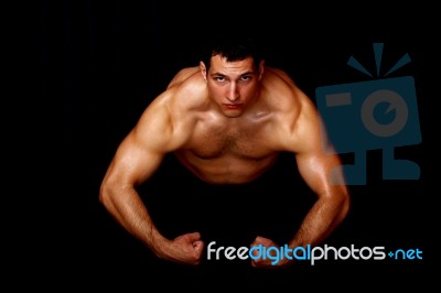 Bodybuilder Showing His Strength Stock Photo