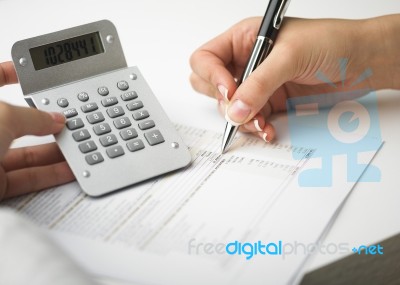 Bookkeeping With Calculator Stock Photo