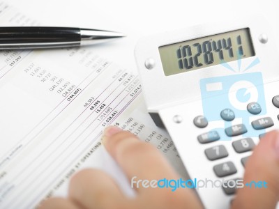 Bookkeeping With Calculator Stock Photo