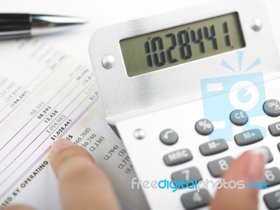 Bookkeeping With Calculator Stock Photo