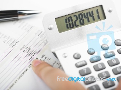 Bookkeeping With Calculator Stock Photo