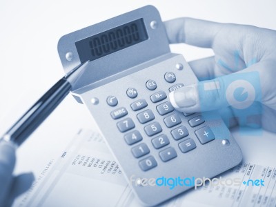 Bookkeeping With Calculator Stock Photo