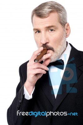 Boss Smoking A Cigar Stock Photo