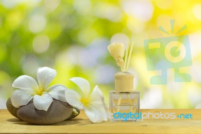 Bottle-conditioned With Plumeria Stock Photo