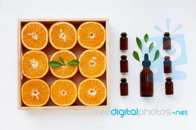 Bottle Of Essential Oil From Oranges Citrus Fruit With Fresh Ora… Stock Photo